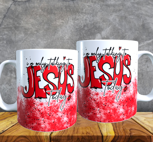 two coffee mugs sitting on top of a wooden table