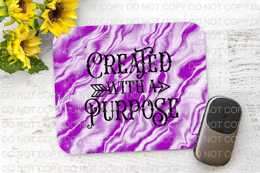 a mouse pad with the words, created with purpose on it